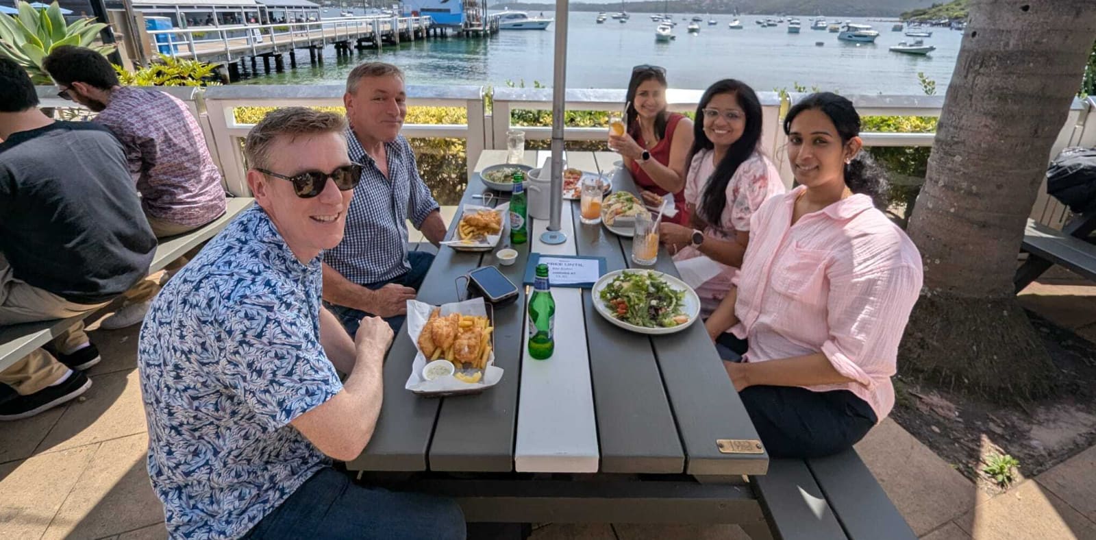 Colleagues over lunch on Sydney Harbour