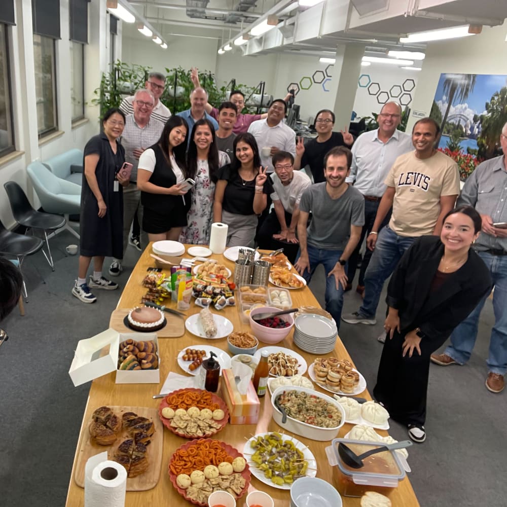 Team members at a shared lunch in the office